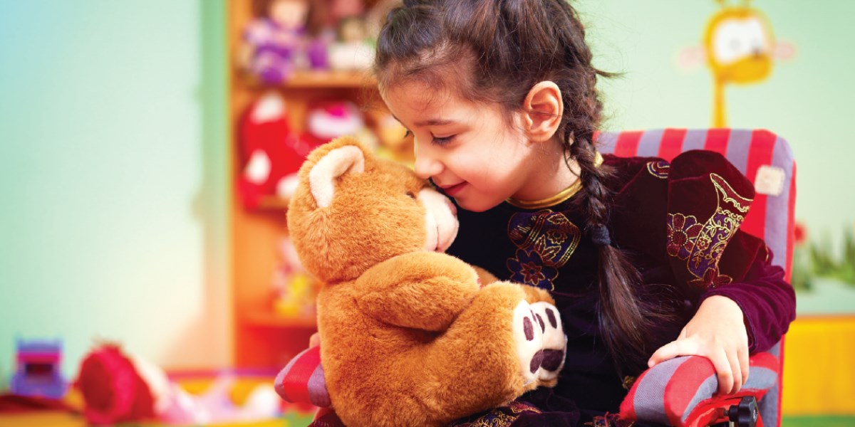 Little girl with a teddy bear