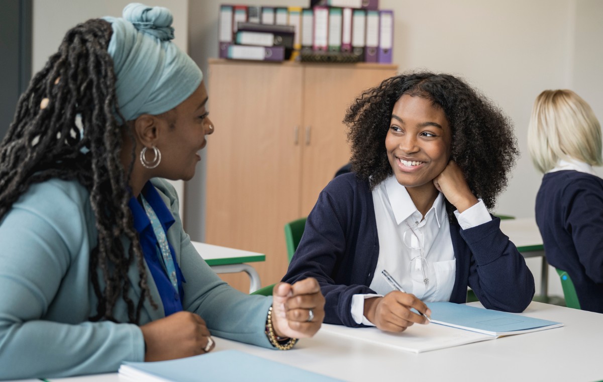 Mental health support team talking to teenage girl