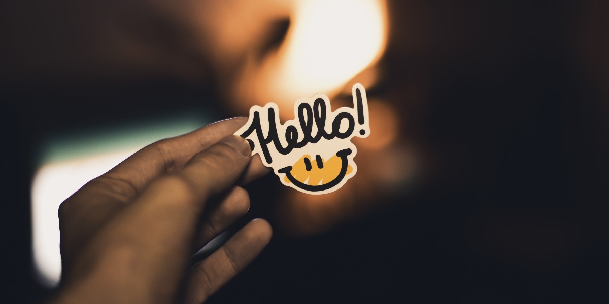 person holding hello sign