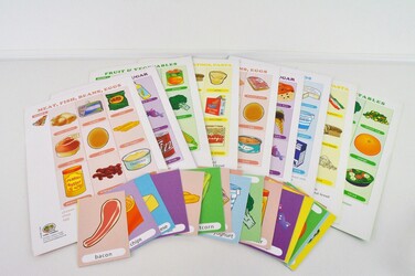 A variety of different food boards with different food cards in front. 